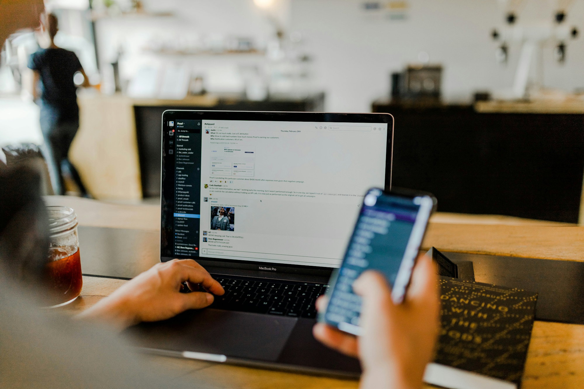 person-using-phone-and-laptop.jpg person using phone and laptop